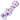 Angled close-up of the pink glass DankStop Frit Cone One Hitter - 3 in. showing black flecks, purple dots, and glossy reflections.