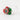 A close-up, angled view of the Hootie PuffCo Peak Pro Glass Ball Cap with vibrant green and red swirls.