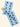 Diagonal flat-lay of Field Trip Rolling Papers Third Eye Pre-Roll Cones on cream background, showing blue papers printed with repeated stylized eye motifs and a small pile of loose herb.