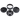 Overhead view of the disassembled Cali Cloud X 90mm 3-Stage Aluminum Grinder, showing its tiered sections and dark metallic finish.