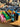A top-down view of the Stage 2 Joint Case holding several smoking accessories against a blurred background.