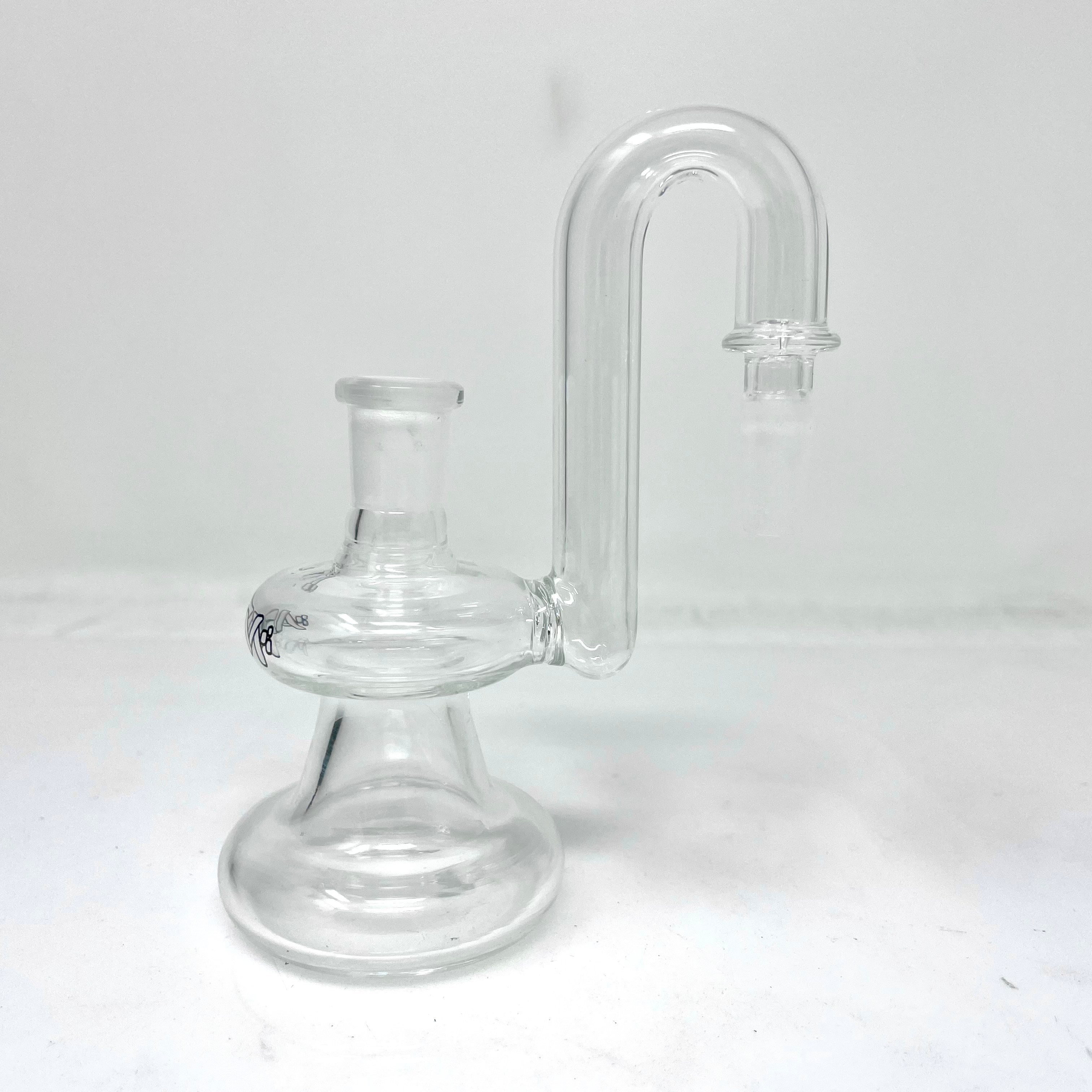 A clear, angled view of the Dry Ashcatcher, showcasing its simple glass construction and smooth curves against a plain white background.