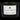 Front view of the Queen of Bud Candle, a black container with a minimalist label, set against a dark background.