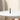 Centered front view of the ONGROK USA Taster Bat - Aluminum One-Hitter standing upright on a white round table against a neutral wall.