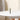 Centered front view of the green ONGROK USA Taster Bat - Aluminum One-Hitter standing upright on a white round table against a soft beige background