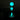 A close-up, angled view of the glowing-in-the-dark glass Terp Slurper Set, illuminated against a dark background.