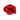 A close-up, angled view of the Lip Service Ashtray, showcasing its glossy red, sculptural lip-shaped design.