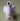 Front view of the Elephant Pipe, a sculpted ceramic piece presented against a solid green background.