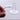 A close-up, angled view of the Opaque Bottom Full Weld Blender Quartz Banger held against a blurred background.