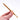 A close-up shows the Pearl Grabber Tool held between fingers, highlighting its metallic finish and detailed grip texture.