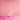 The Bong stands centered on a matching pink platform, lit with soft studio lighting.