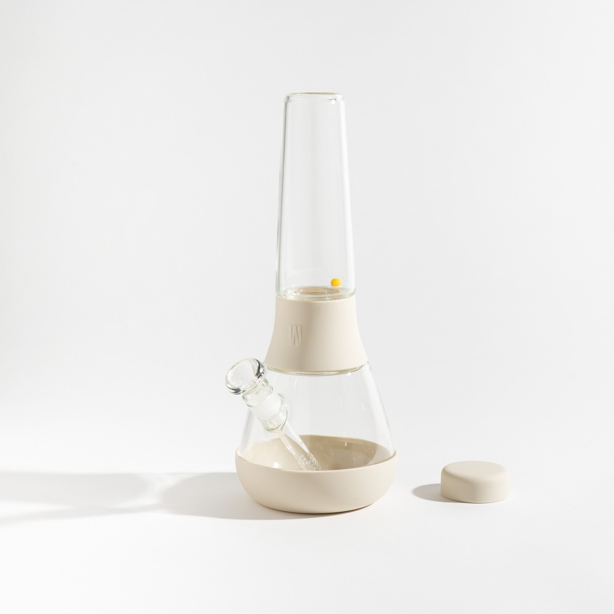 The Bong presents a front view of the clear glass water pipe with a minimalist design against a plain white background.