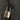 A close-up, angled view of The Shorty - Smell Proof Mini Backpack’s zipper pull, featuring a black and silver locking mechanism.