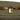 Close-up of The Stowaway - Smell Proof Toiletry Kit, featuring a zipper against a textured, dark green background.