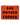 Close-up of Vinyl Stickers displaying bold, black lettering against a vibrant red background.