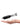 A hand displays the black Trio Vaporizer, angled slightly upwards against a plain white background.