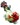 A close-up, angled view of the Ribbit Spoon Pipe, showing a red and green sculpted pipe resembling a frog.