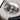 Close-up view of the Loading Tool, showcasing a metallic instrument against a blurred, dark background.