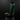 Close-up, front view of the Capsule Water Pipe with a green lighter resting on its upper rim against a dark background.