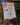 A close-up shows the Bud Bouquet Greeting Card displayed on a miniature easel against a blurred background.