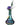A vibrant, angled view of the Member Test, showcasing a glass piece with colorful accents and a blooming purple flower.