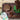 Overhead view of the Woodland Turtle Set displayed on a dark wood surface with a small patterned container.