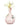 A front view of the “Rachel” Water Pipe, featuring a light pink glass body with a delicate floral arrangement nearby.