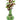 Front view of the Turtle Water Pipe, a green glass piece with a textured surface and floral arrangement in the neck.