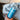Close-up view of the Pure Isopropyl Alcohol bottle held in a hand, displaying the clear liquid inside against a blurred background.