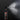 A close-up shot of the Odor Eliminating Spray bottle against a dark backdrop, with a spray mist visible in the air.