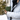 A close-up, angled view shows the Carbon-lined Locking Wallet held in a gloved hand against a white jacket.