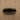 Overhead view of the open Carbon-lined Locking Wallet, revealing a dark interior against a wooden surface.