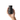A hand holds the Plant-Based Air Filter, showcasing its compact size and smooth, rounded form against a plain white background.