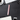 Overhead view of the Premium Storage Tube alongside a keyboard and office supplies on a dark surface.