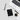 Overhead view of the Premium Storage Tube next to a coffee cup and keyboard on a white surface.