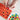 A top-down view shows hands filling the shapes of the Silicone Gummy Mold Kit with colorful, translucent liquid.