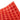 A close-up, top-down view of the Silicone Gummy Mold Kit, showing multiple circular indentations in a flexible, red material.