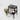 A high-angle view of the 5 Piece Storage Grinder on a dark wooden stool with a vibrant green plant.
